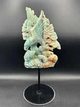 Load image into Gallery viewer, Carved stone sculpture of a bird on a stand against a gray background