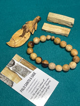 Load image into Gallery viewer, Palo Santo feather, bracelet and blocks set with crystal info card
