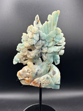 Load image into Gallery viewer, Carved stone leaf pendant on a black background