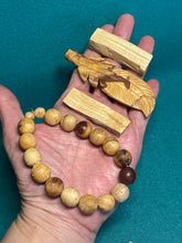 Load image into Gallery viewer, Palo Santo feather, bracelet and blocks set with crystal info card
