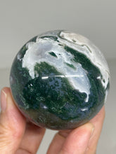 Load image into Gallery viewer, 56mm Moss Agate Sphere Z58 with crystal info card
