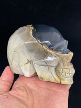 Load image into Gallery viewer, UV Reactive Volcanic Agate Skull with crystal info card Z88
