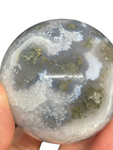 Load image into Gallery viewer, 56 mm Moss Agate sphere ZF69 with druzy and crystal info card
