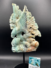 Load image into Gallery viewer, Carved stone sculpture of an eagle on a dark background
