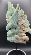 Load and play video in Gallery viewer, Gorgeous Sky Blue Quartz Eagle on Custom Stand SZ35 Strength vision
